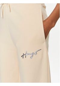 Hugo Spodnie dresowe Easy 50509171 Beżowy Relaxed Fit. Kolor: beżowy. Materiał: bawełna