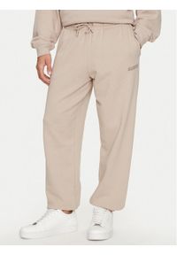 Guess Spodnie dresowe Emis Z4YB00 KAIJ1 Beżowy Relaxed Fit. Kolor: beżowy. Materiał: bawełna