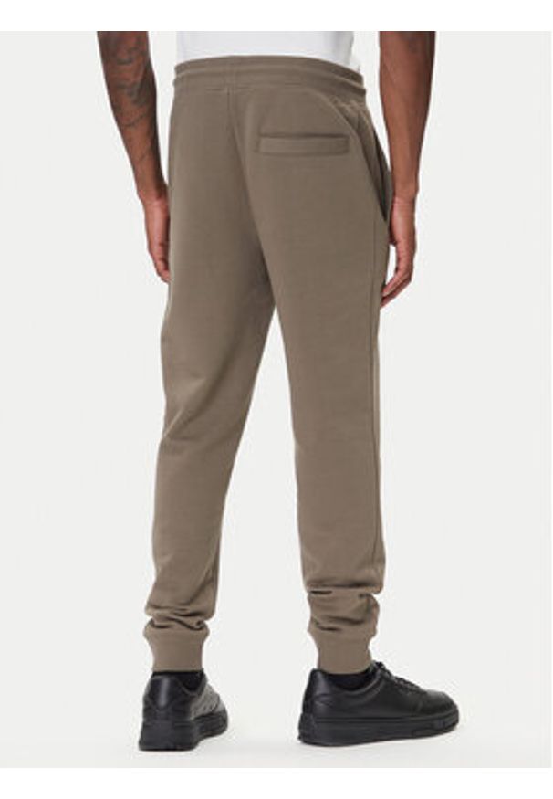 Hugo - HUGO Spodnie dresowe Doak212 50447963 Beżowy Regular Fit. Kolor: beżowy. Materiał: bawełna