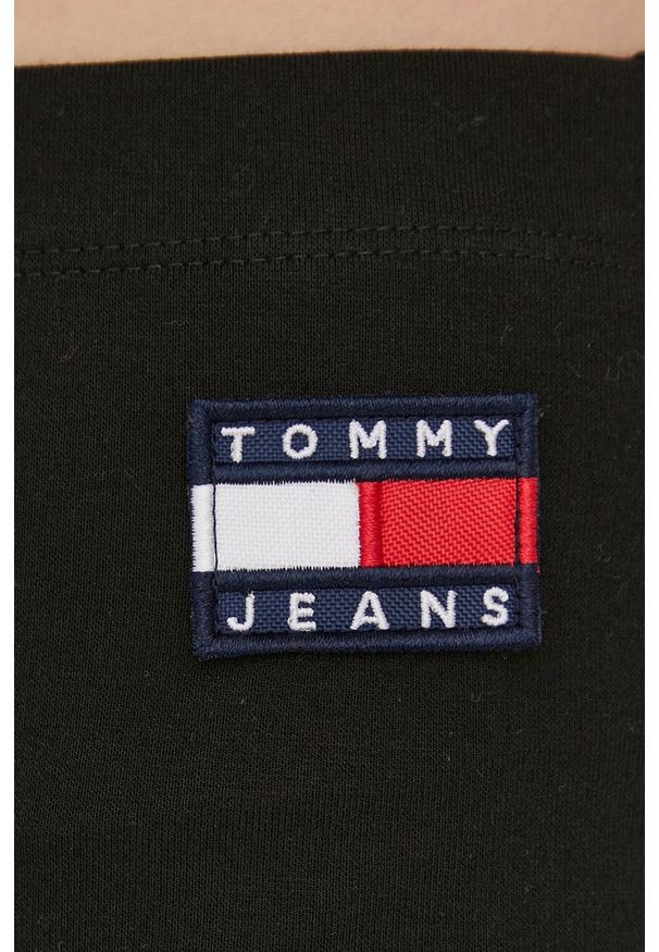 Tommy Jeans spodnie damskie kolor czarny dzwony high waist. Stan: podwyższony. Kolor: czarny. Materiał: poliester. Wzór: aplikacja
