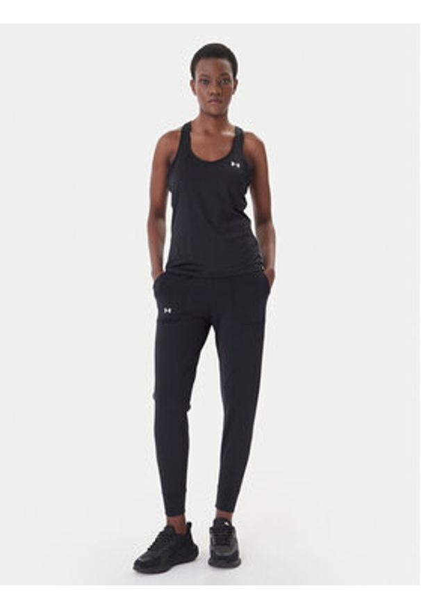 Under Armour Spodnie dresowe Motion 1375077 Czarny Slim Fit. Kolor: czarny. Materiał: syntetyk