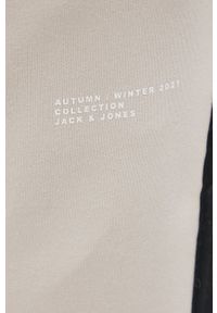Jack & Jones Spodnie męskie kolor kremowy gładkie. Kolor: beżowy. Materiał: dzianina. Wzór: gładki