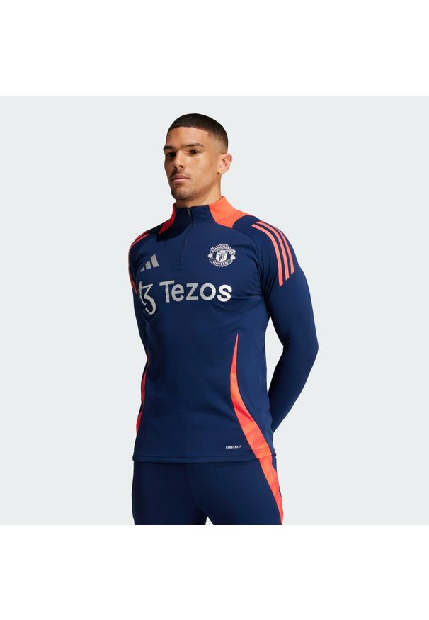 Adidas - Bluza Manchester United Tiro 24 Training. Kolor: niebieski, czerwony, wielokolorowy. Materiał: materiał