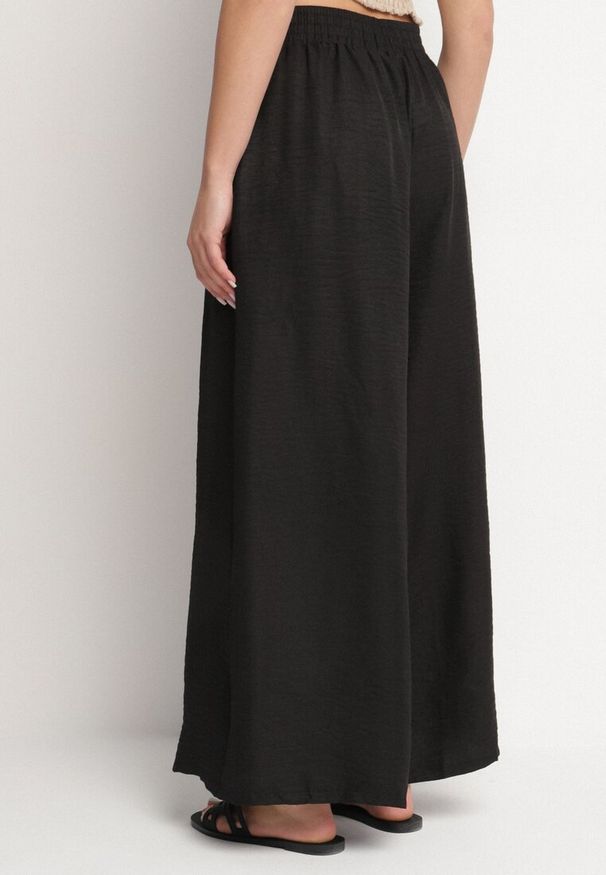 Born2be - Czarne Spodnie o Szerokim Kroju z Wysokim Stanem i Wiązaniem Telarieta. Okazja: na co dzień. Stan: podwyższony. Kolor: czarny. Materiał: len. Styl: elegancki, casual, klasyczny