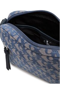 Calvin Klein Saszetka Slouched Monogram Mini Zip Fligh LV04G3175G Błękitny. Kolor: niebieski. Materiał: materiał #5