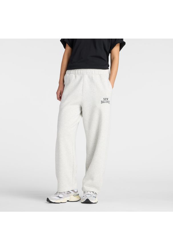 Spodnie damskie New Balance WB61W1DZAHH – szare. Stan: podwyższony. Kolor: szary. Materiał: poliester, bawełna, dresówka, guma
