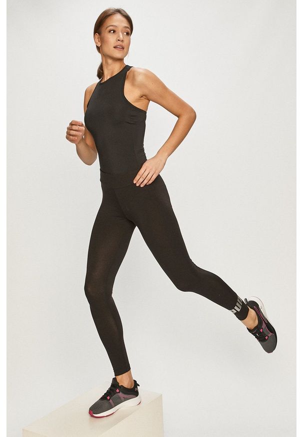 Puma - Legginsy. Kolor: czarny. Materiał: dzianina. Wzór: gładki