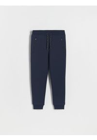 Reserved - Dresowe spodnie jogger - granatowy. Kolor: niebieski. Materiał: dresówka #1