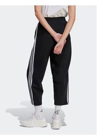 Adidas - adidas Spodnie dresowe Essentials 3-Stripes Open Hem Fleece HZ5748 Czarny Loose Fit. Kolor: czarny. Materiał: bawełna #2