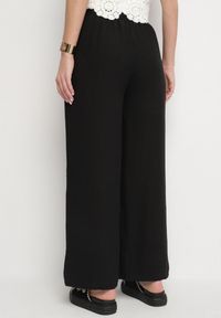 Born2be - Czarne Spodnie o Szerokim Kroju Palazzo z Wysokim Stanem i Wiązaniem Araloria. Okazja: na co dzień. Stan: podwyższony. Kolor: czarny. Styl: elegancki, casual #4
