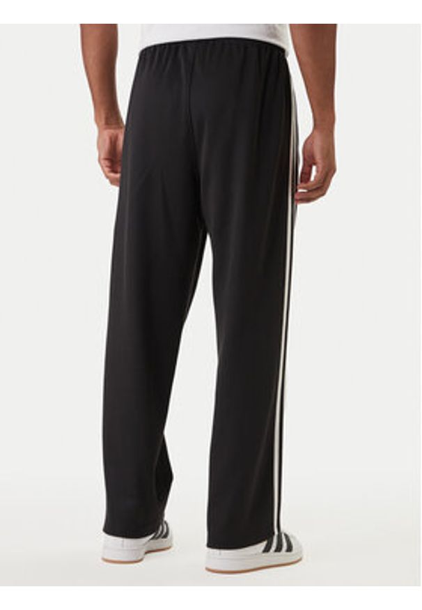 Adidas - adidas Spodnie dresowe adicolor KE3501 Czarny Loose Fit. Kolor: czarny. Materiał: bawełna