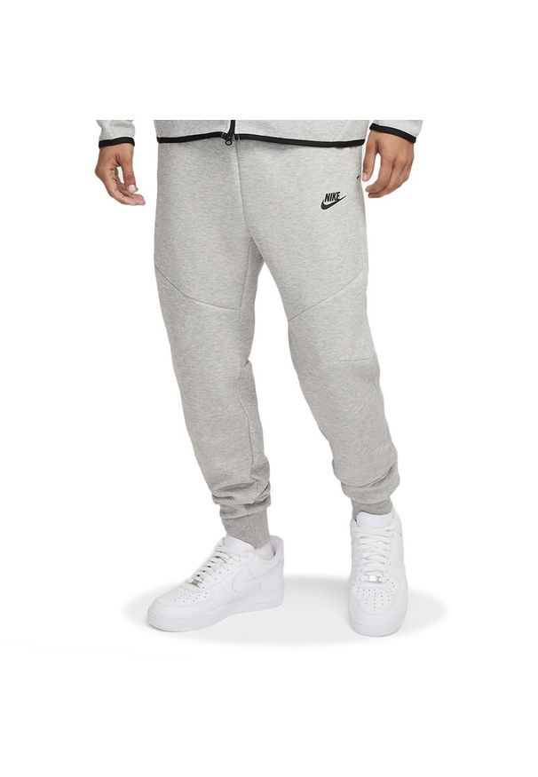 Spodnie męskie Nike Tech HV0959-063 - szare. Kolor: szary. Materiał: dresówka, poliester, bawełna. Wzór: aplikacja