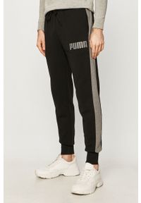 Puma - Spodnie. Kolor: czarny. Materiał: dzianina #1