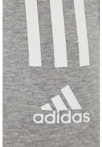Adidas - adidas legginsy damskie kolor szary z nadrukiem. Kolor: szary. Materiał: materiał. Wzór: nadruk #2