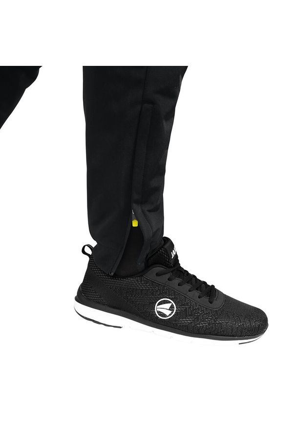 Spodnie dresowe Jako polyester Competition 2.0. Kolor: żółty, wielokolorowy, czarny. Materiał: dresówka. Sport: piłka nożna