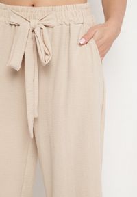 Born2be - Beżowe Szerokie Spodnie z Wiskozą Wiązane w Pasie Zilenna. Okazja: na co dzień. Kolor: beżowy. Materiał: wiskoza. Styl: klasyczny, elegancki, casual #7