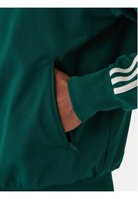 Adidas - adidas Bluza Firebird KD8314 Zielony Loose Fit. Kolor: zielony. Materiał: syntetyk #5