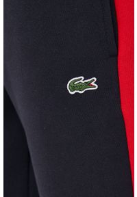 Lacoste spodnie dresowe kolor czerwony wzorzyste. Kolor: czerwony. Materiał: dresówka #4