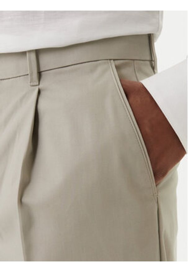 Calvin Klein Chinosy LV04LE612G Beżowy Slim Fit. Kolor: beżowy. Materiał: bawełna