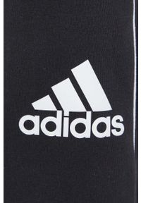 Adidas - adidas spodnie dresowe damskie kolor czarny z nadrukiem. Stan: podwyższony. Kolor: czarny. Materiał: dresówka. Wzór: nadruk