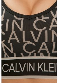 Calvin Klein Performance - Biustonosz sportowy. Kolor: czarny. Materiał: poliester, materiał, elastan #4