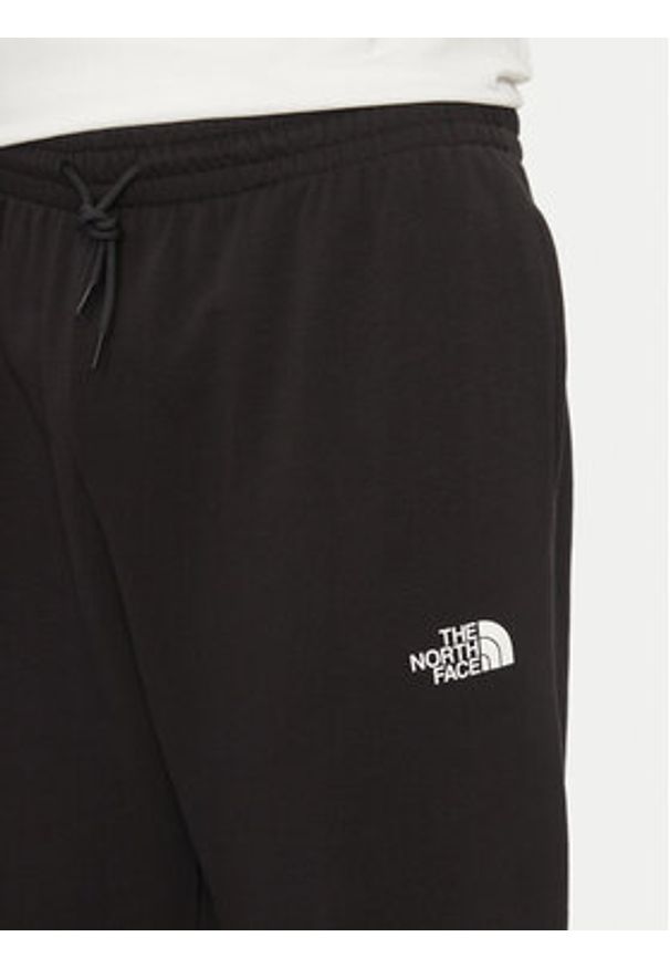 The North Face Spodnie dresowe Simple Dome Light NF0A8C41 Czarny Regular Fit. Kolor: czarny. Materiał: bawełna, syntetyk