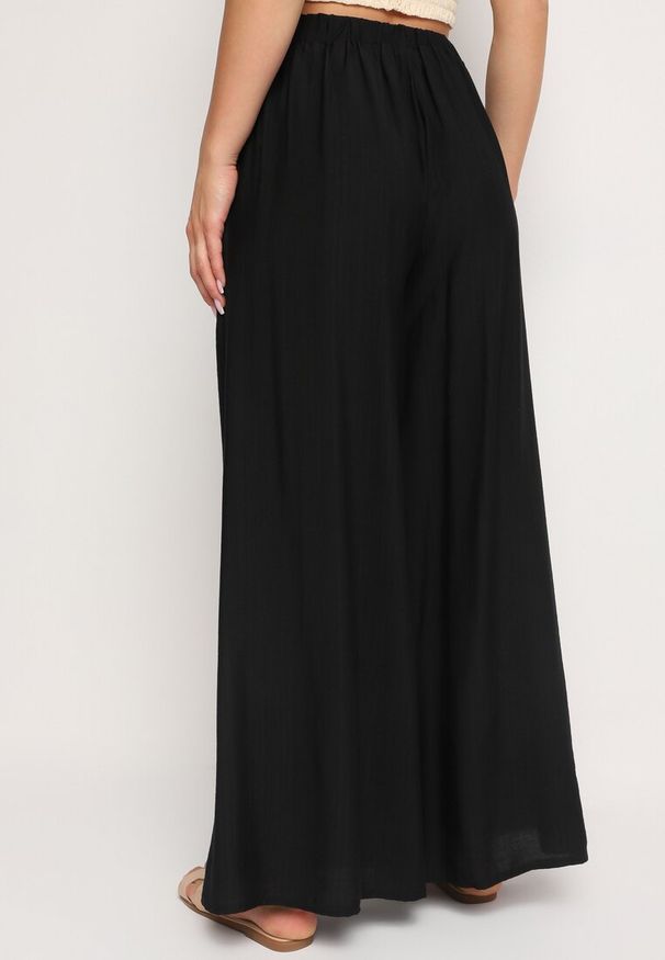 Born2be - Czarne Szerokie Spodnie z Gumką w Pasie i Kieszeniami przy Biodrach Boulia. Kolor: czarny