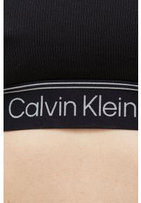 Calvin Klein Performance biustonosz sportowy CK Athletic kolor czarny gładki. Kolor: czarny. Materiał: materiał. Rodzaj stanika: wyciągane miseczki. Wzór: gładki. Sport: fitness, taniec #2