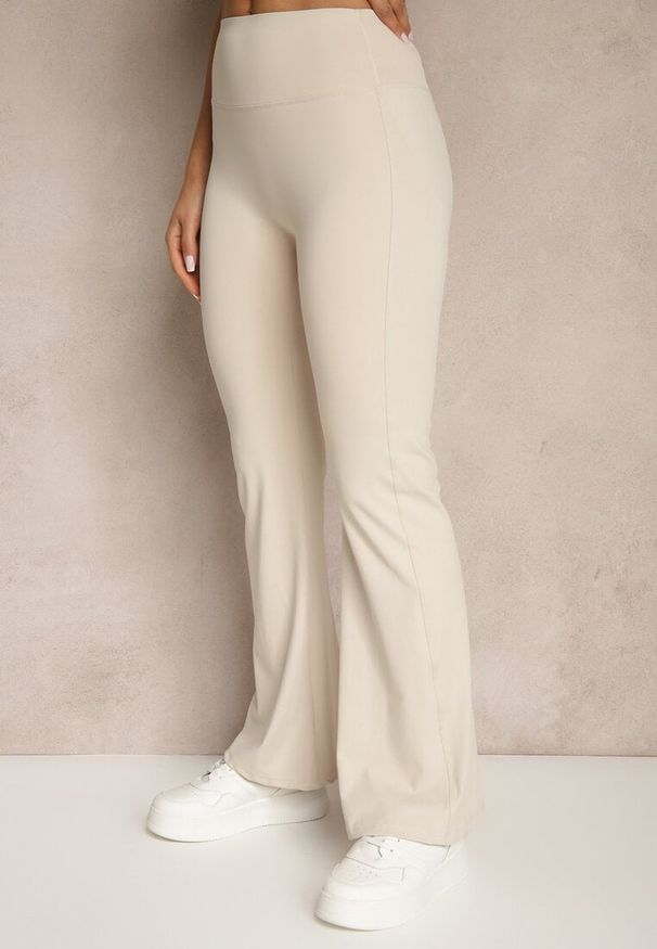 Renee - Beżowe Spodnie Dzwony Legginsy High Waist Onellin. Okazja: na co dzień, na uczelnię. Stan: podwyższony. Kolor: beżowy. Styl: retro, elegancki, casual