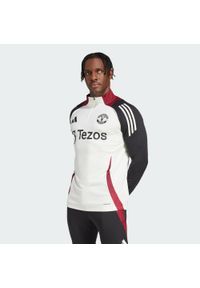 Adidas - Bluza Manchester United Tiro 24 Training. Kolor: czarny, biały, wielokolorowy. Materiał: dresówka, materiał. Sport: piłka nożna