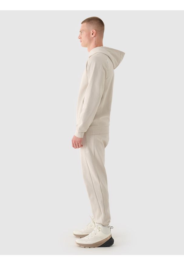 4f - 4F Spodnie dresowe joggery męskie - beżowe XXL. Kolor: beżowy. Materiał: dresówka. Wzór: ze splotem, gładki. Sport: fitness
