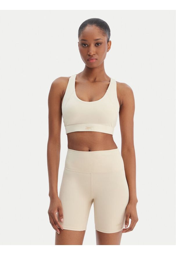 Reebok Biustonosz sportowy Reebok x Ewa Chodakowska RK25615CCW Beżowy. Kolor: beżowy. Materiał: syntetyk