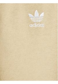 Adidas - adidas Spodnie dresowe adicolor HK2860 Beżowy Regular Fit. Kolor: beżowy. Materiał: bawełna