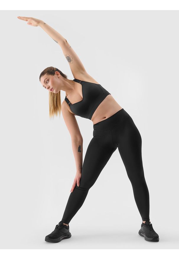 4f - Legginsy treningowe z materiału z recyklingu damskie - czarne. Kolor: czarny. Materiał: materiał. Wzór: jednolity, ze splotem, gładki. Sport: joga i pilates, fitness