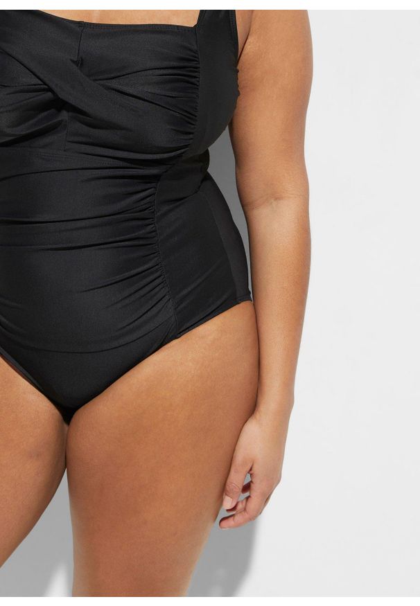 bonprix - Kostium kąpielowy shape z kopertowym dekoltem, średni stopień modelowania sylwetki. Kolor: czarny. Materiał: materiał