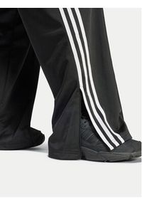 Adidas - adidas Spodnie dresowe Firebird IT7404 Czarny Regular Fit. Kolor: czarny. Materiał: syntetyk #5