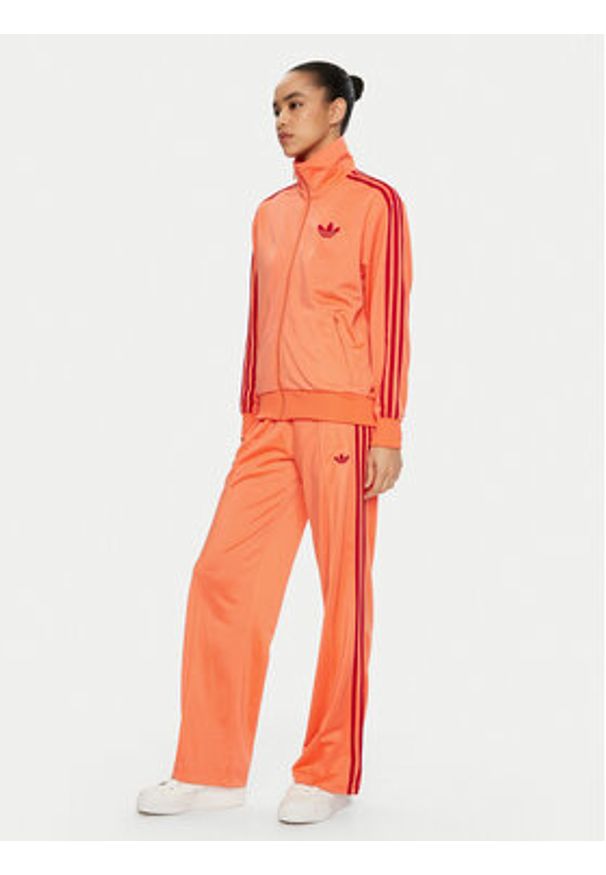 Adidas - adidas Spodnie dresowe adicolor Classic Firebird JP2309 Pomarańczowy Loose Fit. Kolor: pomarańczowy. Materiał: syntetyk