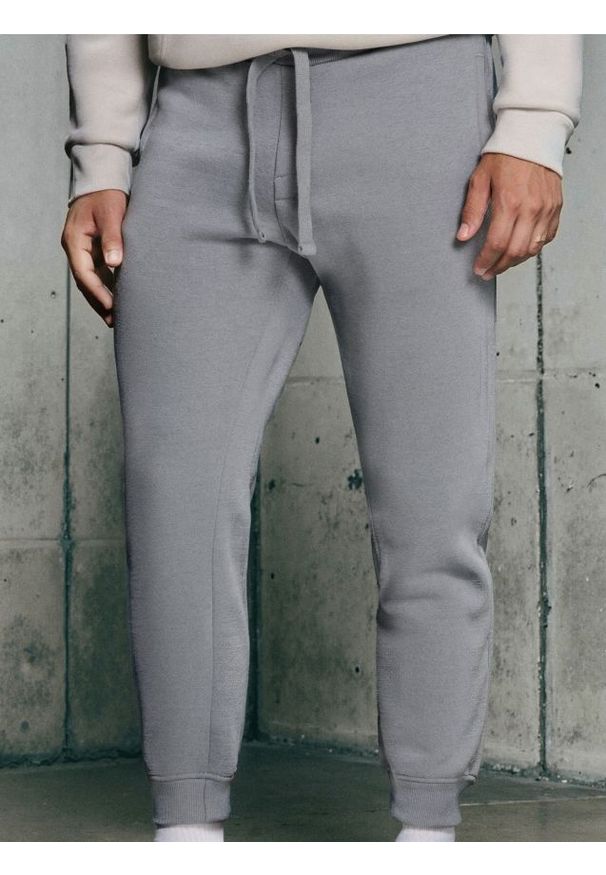 Sinsay - Spodnie dresowe - niebieski. Kolor: niebieski. Materiał: dresówka