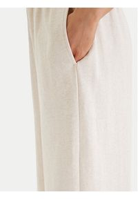 TOMMY HILFIGER - Tommy Hilfiger Spodnie dresowe UW0UW06180 Beżowy Wide Leg. Kolor: beżowy. Materiał: bawełna #2