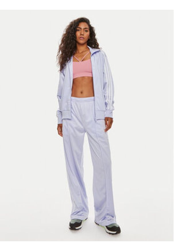 Adidas - adidas Spodnie dresowe Firebird IP0643 Fioletowy Regular Fit. Kolor: fioletowy. Materiał: syntetyk