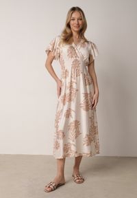 Born2be - Beżowa Wiskozowa Sukienka o Rozkloszowanym Kroju z Kopertowym Dekoltem Morgassa. Okazja: na co dzień. Kolor: beżowy. Materiał: wiskoza. Wzór: kwiaty. Sezon: lato. Typ sukienki: kopertowe. Styl: casual, klasyczny #7