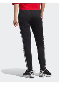 Adidas - adidas Spodnie dresowe adicolor IB5916 Czarny Slim Fit. Kolor: czarny. Materiał: dresówka, bawełna #2