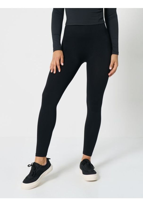 Sinsay - Legginsy sportowe - czarny. Kolor: czarny. Styl: sportowy