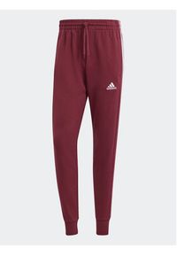 Adidas - adidas Spodnie dresowe Essentials IS1366 Czerwony Regular Fit. Kolor: czerwony. Materiał: bawełna #3
