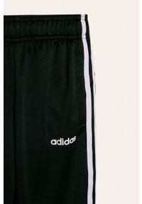 Adidas - adidas - Spodnie dziecięce 128-176 cm. Kolor: czarny. Materiał: tkanina, poliester, dzianina. Wzór: gładki #2