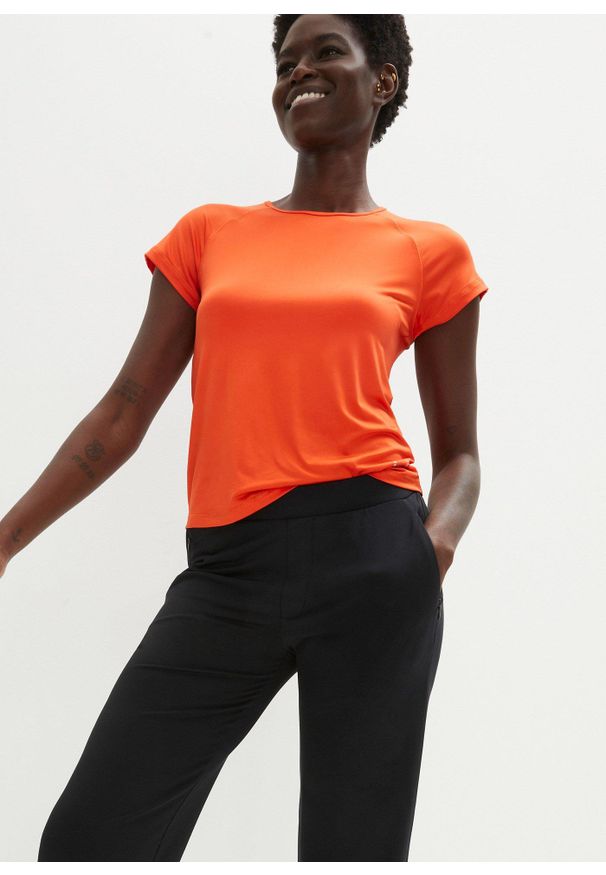 bonprix - Uniwersalne spodnie sportowe z kieszeniami na zamek. Kolor: czarny. Materiał: materiał. Styl: sportowy