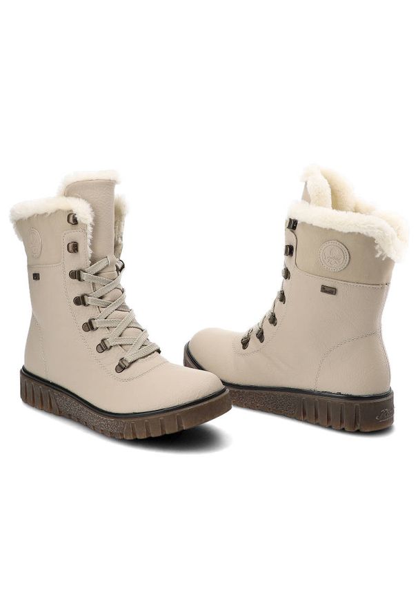 Botki damskie Rieker, cholewka z gładkiej skóry naturalnej z wysoką cholewką i sznurowaniem oraz miękkim obszyciem przy krawędzi gruba podeszwa z wyr. Wysokość cholewki: przed kolano. Kolor: beżowy. Materiał: futro, syntetyk, skóra ekologiczna. Szerokość cholewki: normalna. Wzór: gładki. Obcas: na platformie