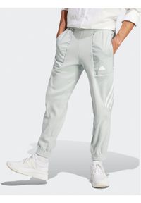 Adidas - adidas Spodnie dresowe Future Icons 3-Stripes IJ8860 Szary Regular Fit. Kolor: szary. Materiał: syntetyk, dresówka