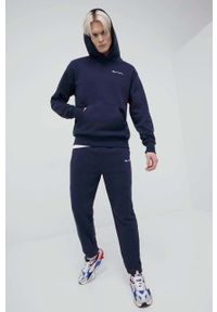 Champion spodnie 217404 kolor granatowy z aplikacją. Kolor: niebieski. Materiał: włókno, dzianina, materiał. Wzór: aplikacja #2