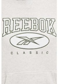 Reebok Classic bluza bawełniana damska kolor beżowy z kapturem z aplikacją. Typ kołnierza: kaptur. Kolor: beżowy. Materiał: bawełna. Długość rękawa: długi rękaw. Długość: długie. Wzór: aplikacja #3
